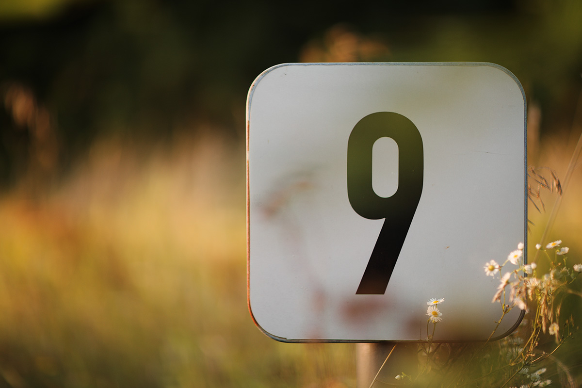 closeup-shot-of-the-sign-of-number-nine-on-a-white-2025-02-02-21-01-05-utc
