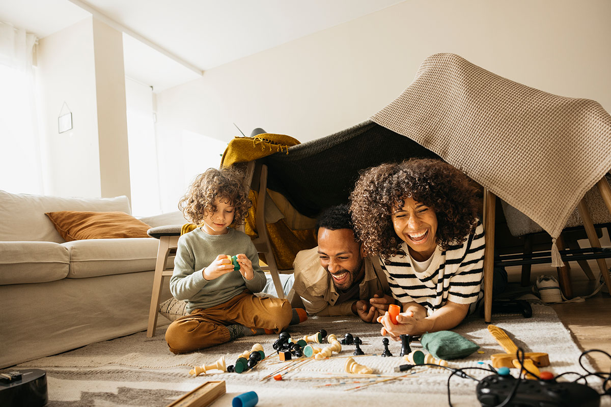 family-laughing-together-in-a-living-room-2025-08-18-21-36-46-utc