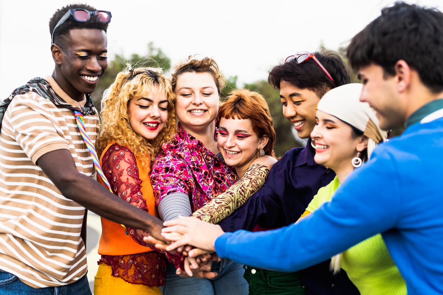 happy-young-diverse-friends-having-fun-stacking-ha-2024-12-03-23-29-45-utc (1) (1)