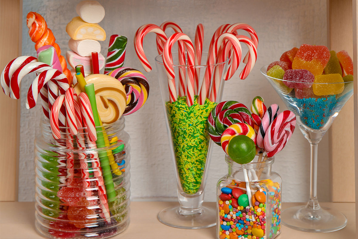 many-different-yummy-candies-on-wooden-shelves-2026-03-05-11-52-39-utc