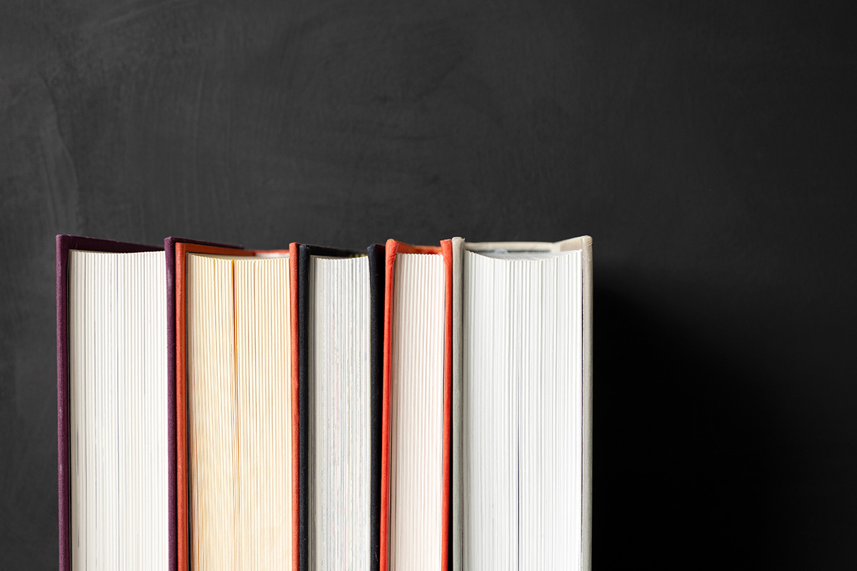 stack-of-books-on-black-cardboard-background-with-2025-01-23-07-34-51-utc