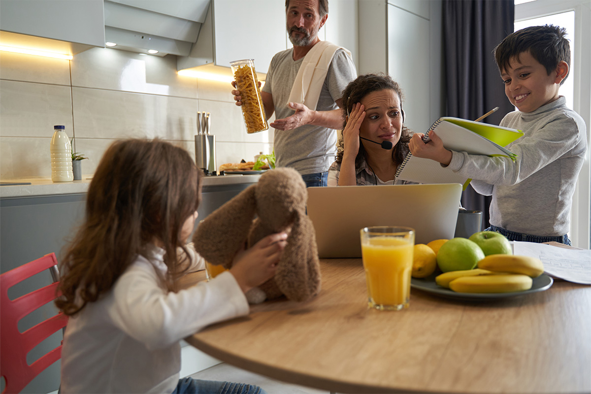 woman-working-on-laptop-looking-with-terror-on-son-2023-11-27-04-55-17-utc